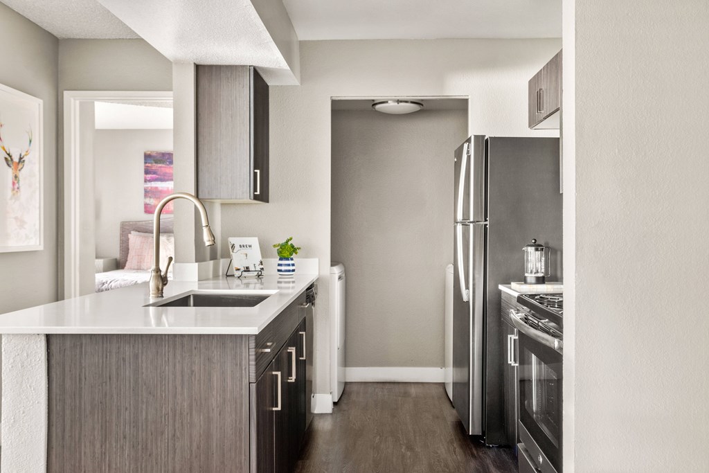 a kitchen in a 555 waverly unit with stainless steel appliances